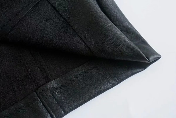 Lühike musta lukuga kunstnahast seelik