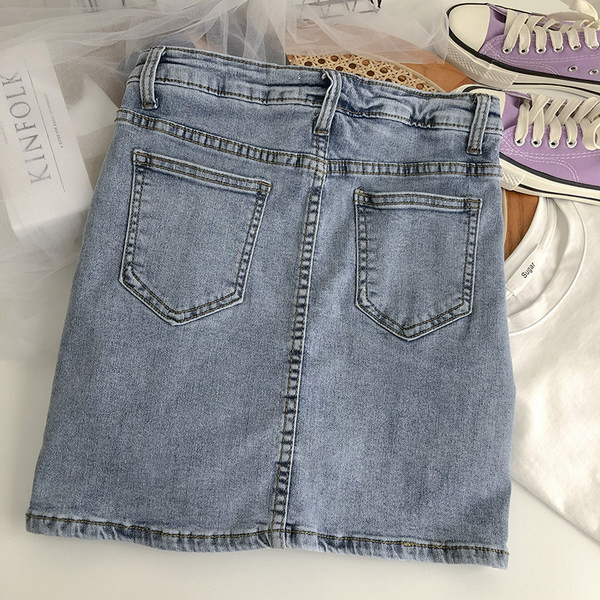 Naiste kõrge vöökoha ja lukuga teksaseelik