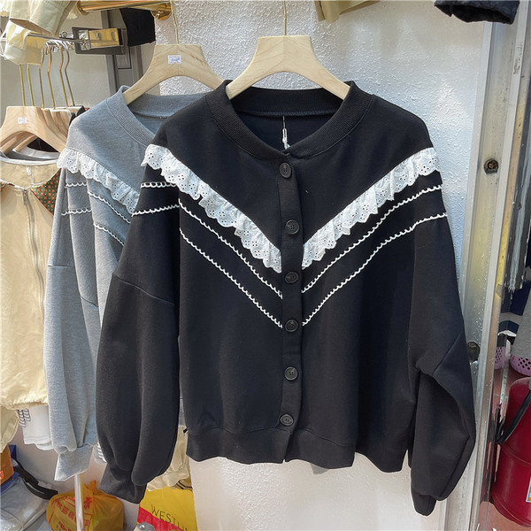 Ümmarguse dekoltee ja nööpidega halli ja musta värvi vabaaja naiste kardigan