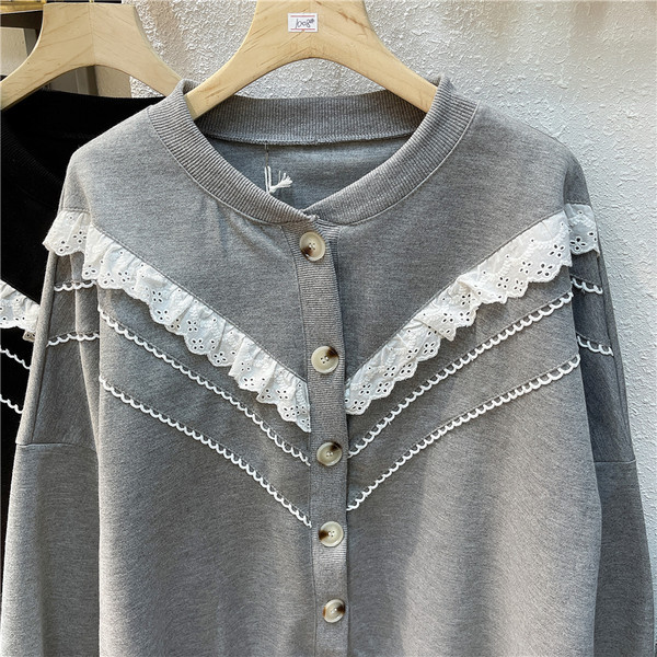 Ümmarguse dekoltee ja nööpidega halli ja musta värvi vabaaja naiste kardigan