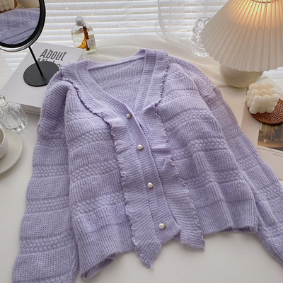 Uue mudeli vest spits-kaelusega ja nööpidega