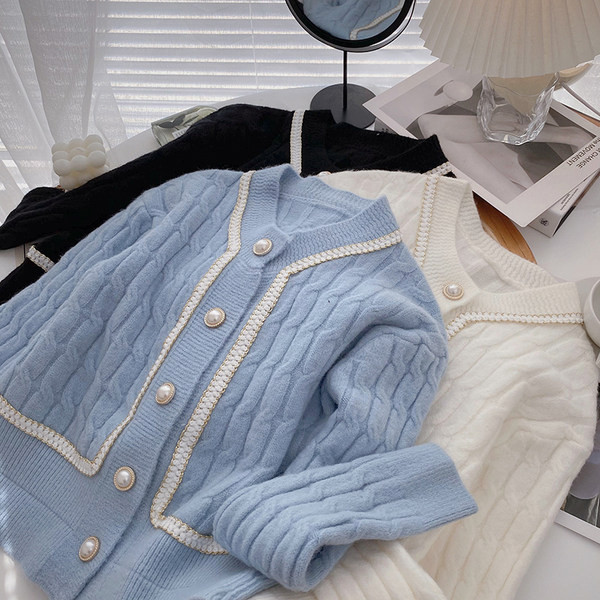 Naiste vabaaja vest nööpide ja pikkade varrukatega