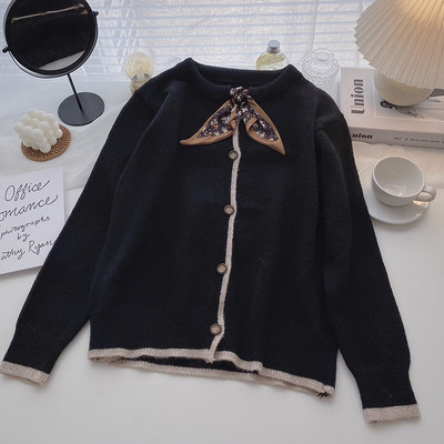 Μοντέρνα  γυναικεία ζακέτα  με οβάλ λαιμόκοψη και κορδέλα