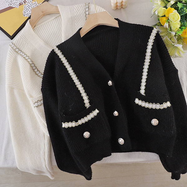 Valge ja musta värvi pärlite ja nööpidega naiste vest