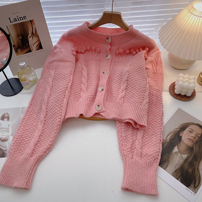 Μοντέρνα ζακέτα με οβάλ λαιμόκοψη και κουμπιά