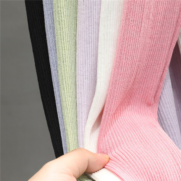 Naiste embleemi ja pikkade varrukatega kardigan