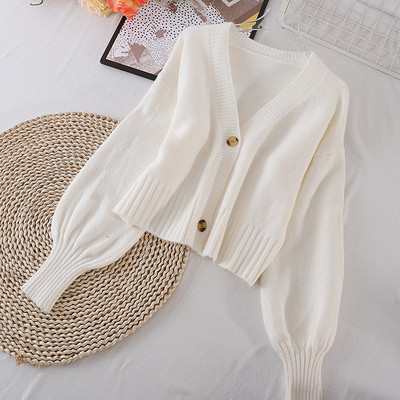 Egyszínű női mellény gombokkal és spitz nyakkivágással