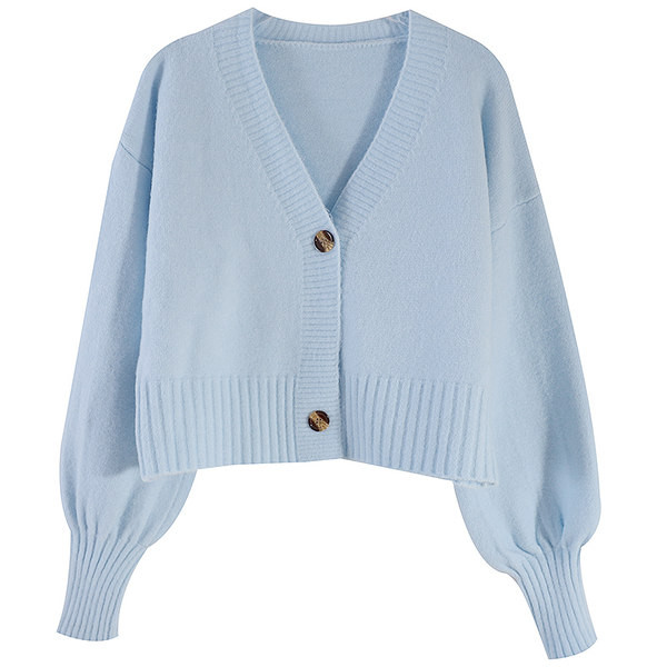 Egyszínű női mellény gombokkal és spitz nyakkivágással