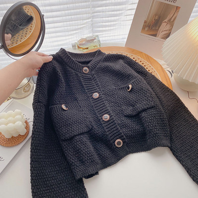 Πλεκτή  ζκέτα με κουμπιά και τσέπες