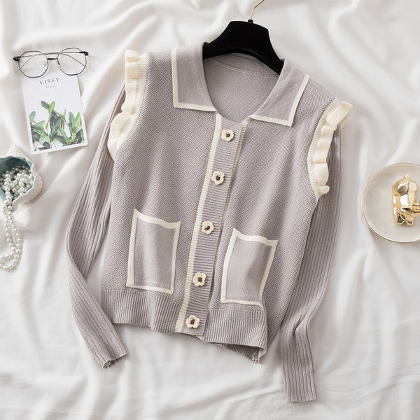 Naiste taskute ja lokkidega kardigan