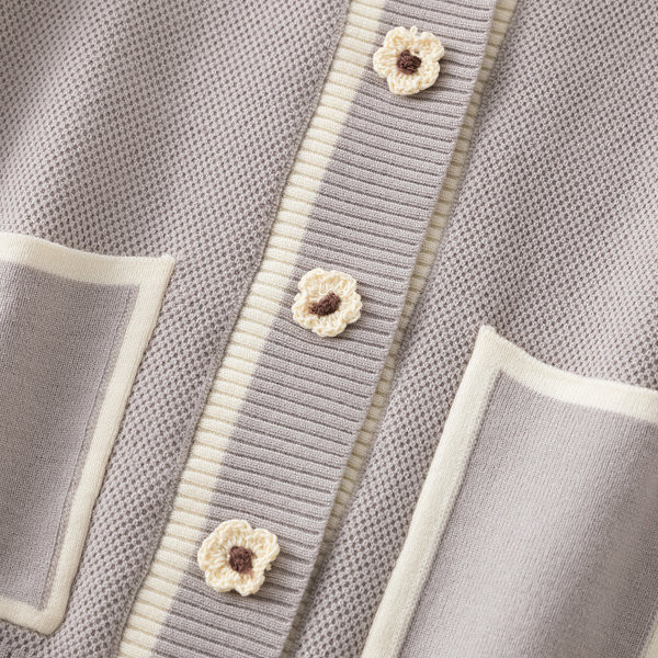 Naiste taskute ja lokkidega kardigan