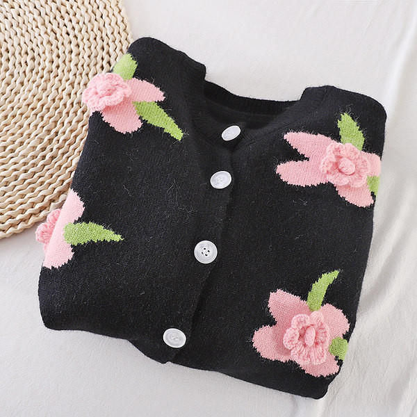 Női kardigán gombokkal és 3D elemmel fekete színben