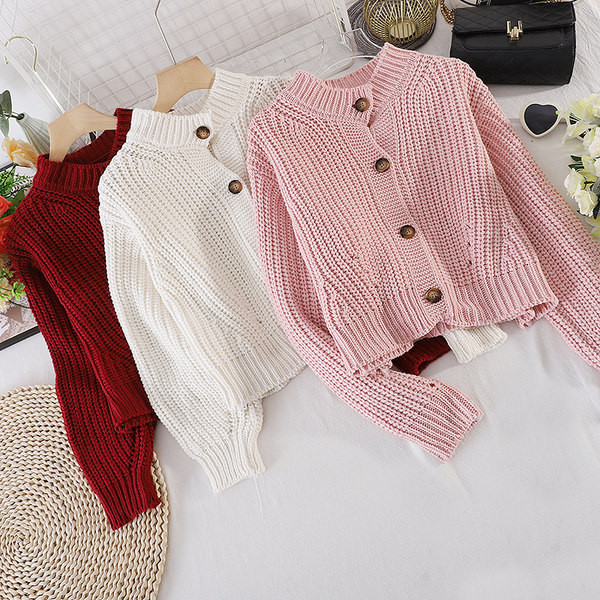 Egyszínű női mellény, gombokkal és hosszú ujjú