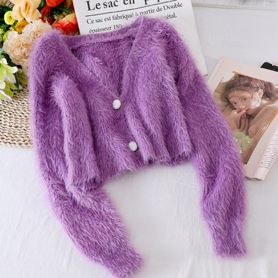 Női pehelymellény gombokkal és spitz nyakkivágással