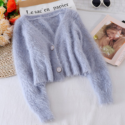 Női pehelymellény gombokkal és spitz nyakkivágással