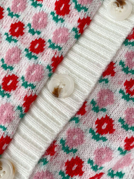 Színes mellény gombokkal és kerek nyakkivágással