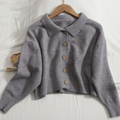 Γυναικεία ζακέτα νέο μοντέλο με φαρδιά μανίκια και στρογγυλά κουμπιά