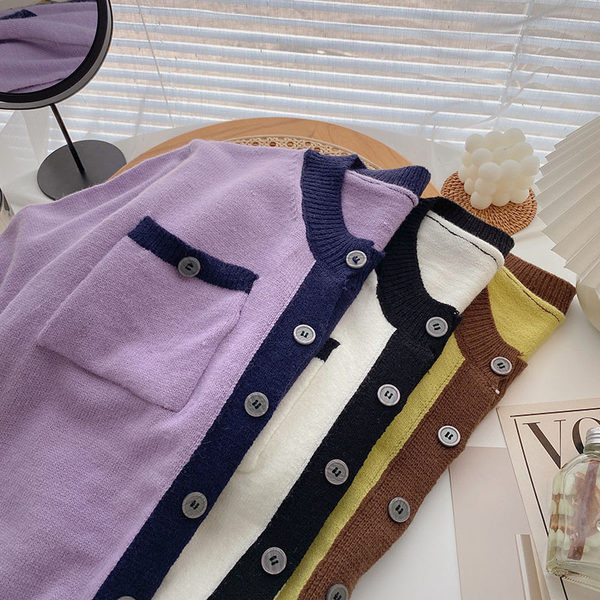 Taskute ja ümara kaelusega vabaaja vest