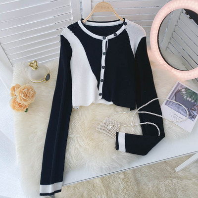 Naiste moodne nööpide ja ovaalse kaelusega vest