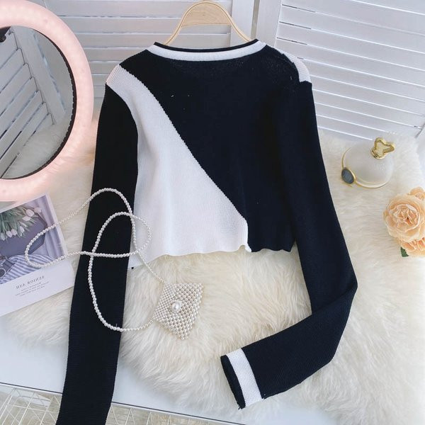 Naiste moodne nööpide ja ovaalse kaelusega vest