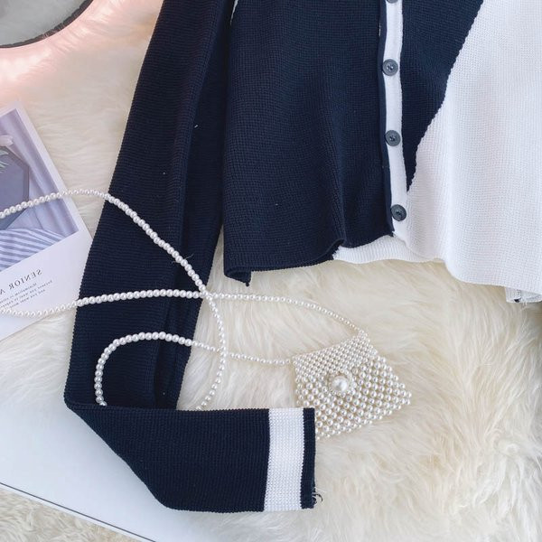 Naiste moodne nööpide ja ovaalse kaelusega vest