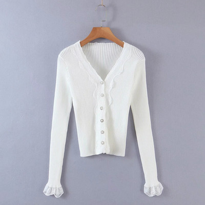 Liibuv velvetist nööpide ja lokkidega vest