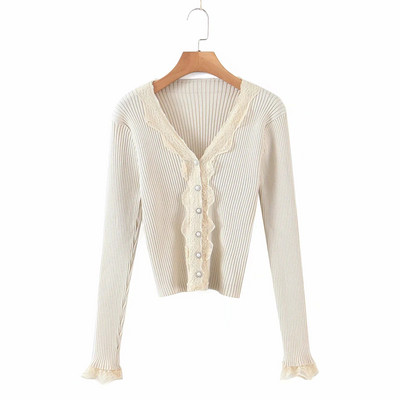 Liibuv velvetist nööpide ja lokkidega vest