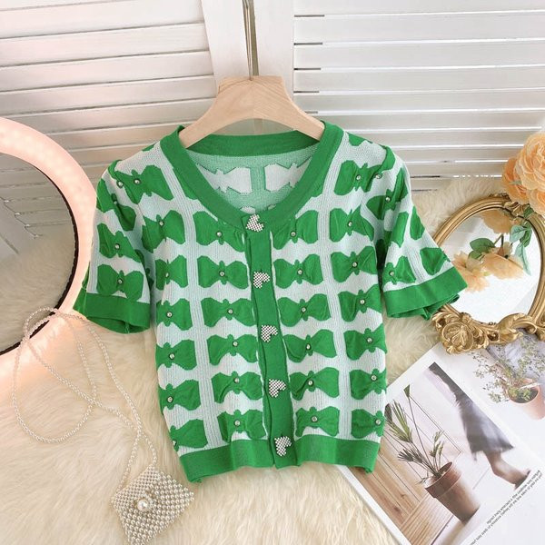 Ovaalse dekoltee ja lühikeste varrukatega naiste vest