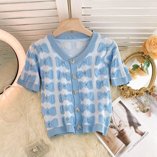 Ovaalse dekoltee ja lühikeste varrukatega naiste vest