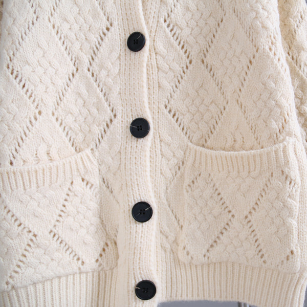 Naiste kootud vest taskute ja ümara kaelusega