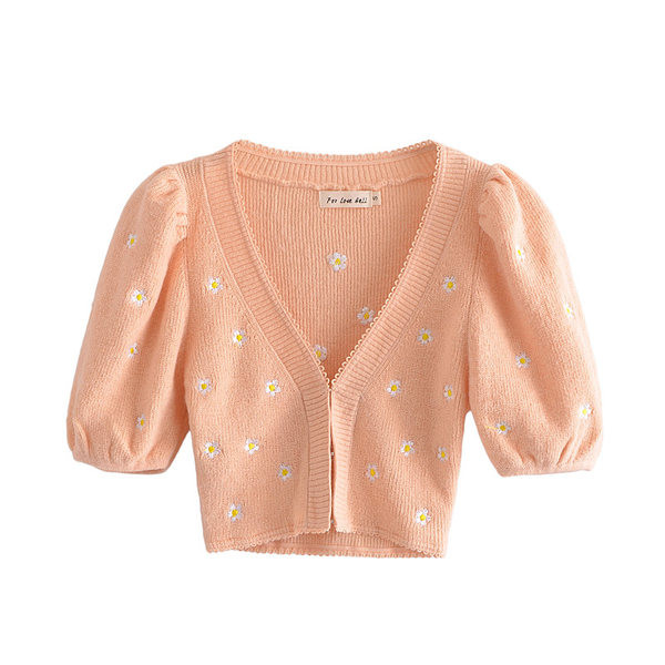 Lühike kootud vest lilltikandi ja spitsikaelusega