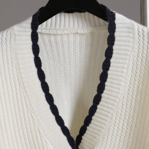 Taskute ja pikkade varrukatega naiste kampsun