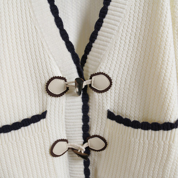 Taskute ja pikkade varrukatega naiste kampsun