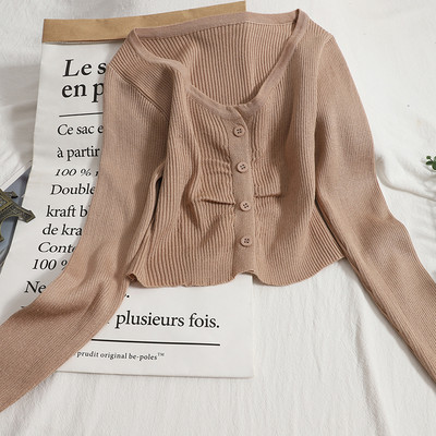 Modern mellény kerek nyakkivágással és hosszú ujjakkal