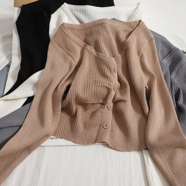 Modern mellény kerek nyakkivágással és hosszú ujjakkal