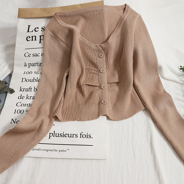 Modern mellény kerek nyakkivágással és hosszú ujjakkal