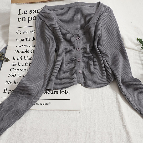 Modern mellény kerek nyakkivágással és hosszú ujjakkal