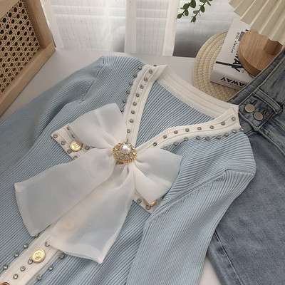 Γυναικεία ζακέτα διακοσμημένη με πέτρες και κορδέλα