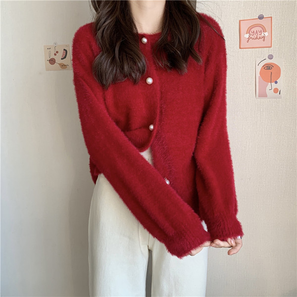 Stiilne naiste vest ovaalse dekoltee ja nööpidega