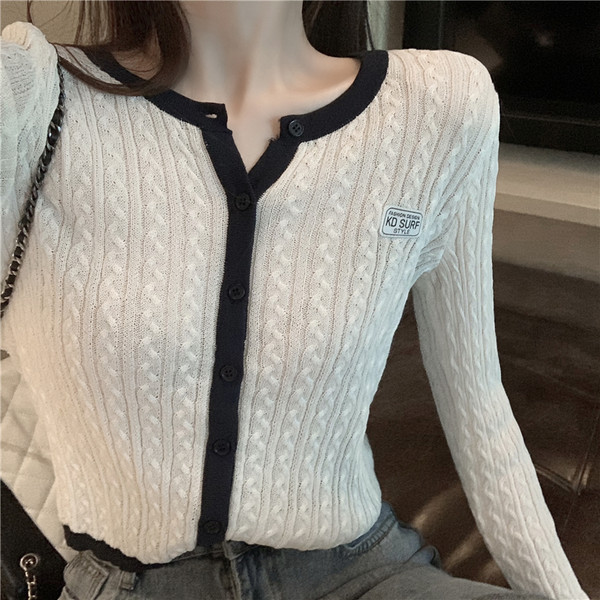 Vestă de damă elegantă, cu decolteu rotund și mâneci lungi