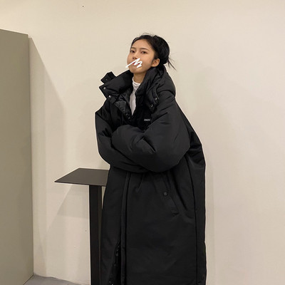 Modern női hosszú kabát széles modell kapucnival