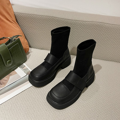 Naiste pruunid ja mustad nahast saapad