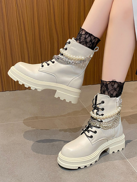 Stílusos női csizma fűzős fém elemekkel és gyöngyökkel