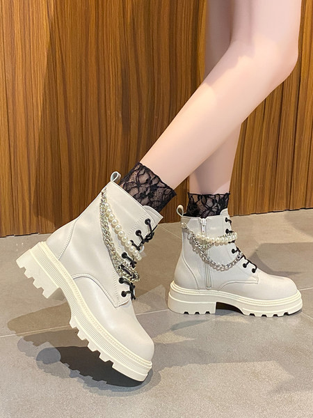 Stílusos női csizma fűzős fém elemekkel és gyöngyökkel