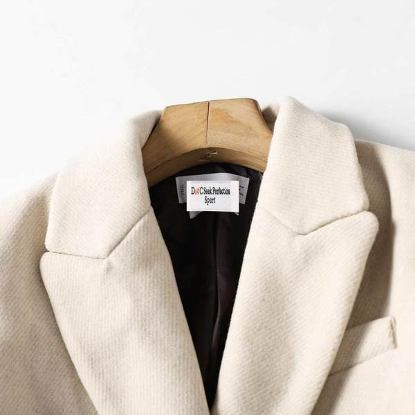 Naiste pikk mantel kaherealise kinnitusega