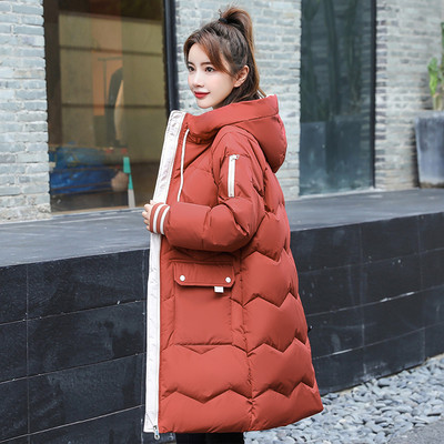 Napi hosszú női kabát kapucnival és zsebekkel