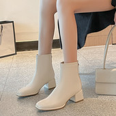 Női bőrcsizma bézs és fekete cipzárral