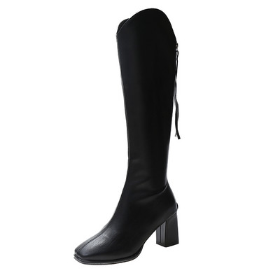 Musta ja beeži värvi lukuga naiste saapad