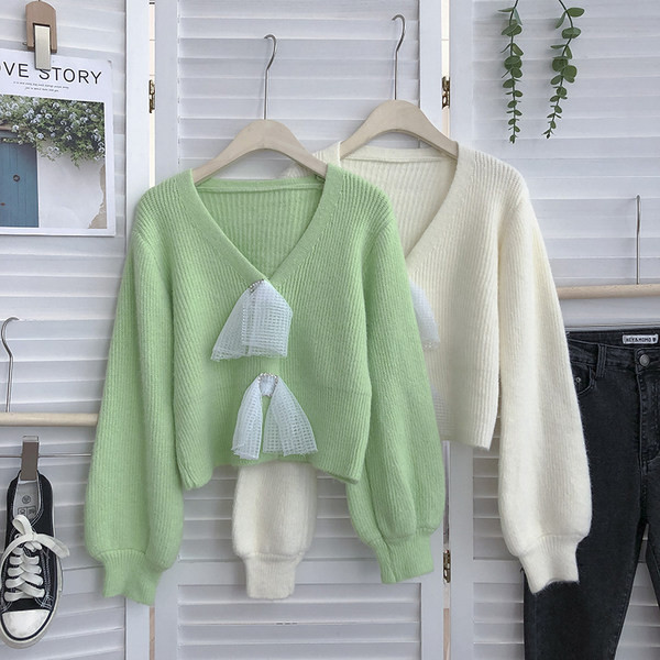 Modern női pulóver spitz nyakkivágással