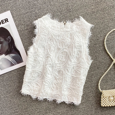 Modern női felső, hímzéssel és cipzárral a hátán